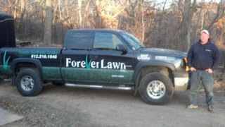 ForeverLawn owner next to company truck